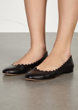 Black scalloped leather ballet flats
